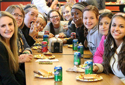 Image: Burgers, fries and some side dishes.