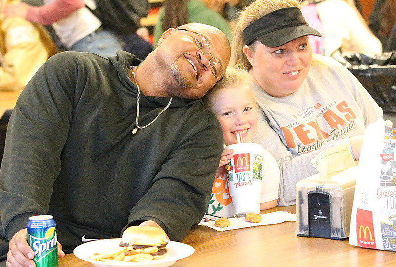 Image: Coach Bobby Campbell poses for a pic with Hannah Rowe and Sheree Rowe.