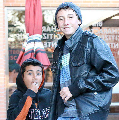 Image: Band dudes Jorge Galvan and Noah Ramirez fill up on fries and burgers.