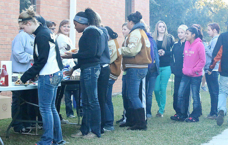 Image: Taylor Turner and K’Breona Davis lead a long line of hungry soldiers.