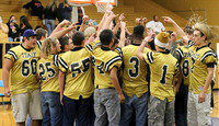 Image: A team huddle wraps up the pep rally.