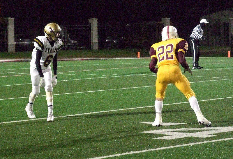 Image: Wide out Clayton Miller(6) tries to help Italy get their passing game going.