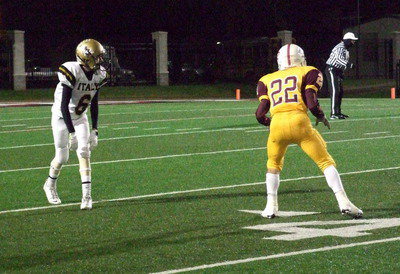 Image: Wide out Clayton Miller(6) tries to help Italy get their passing game going.