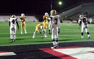 Image: Justin Wood(4), Ryan Connor(7) and Shadrach Newman(25) are ready for anything with Collinsville showing the swinging gate formation before kicking the point-after a touchdown.