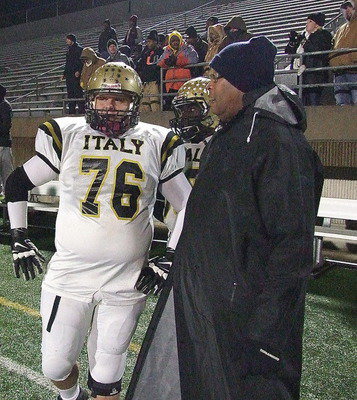 Image: Colin Newman(76) and TaMarcus Sheppard(10) search for answers with assistant coach Larry Mayberry, Sr.