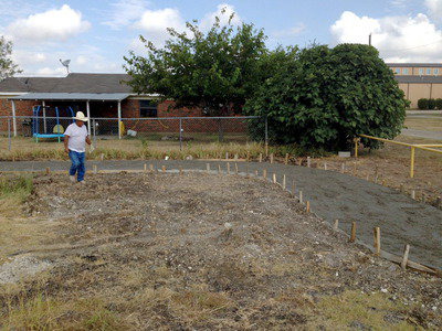 Image: A construction photo of the trail shows the wet concrete ready to be smoothed.