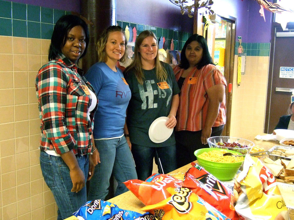 Image: Parents setting out the spread.