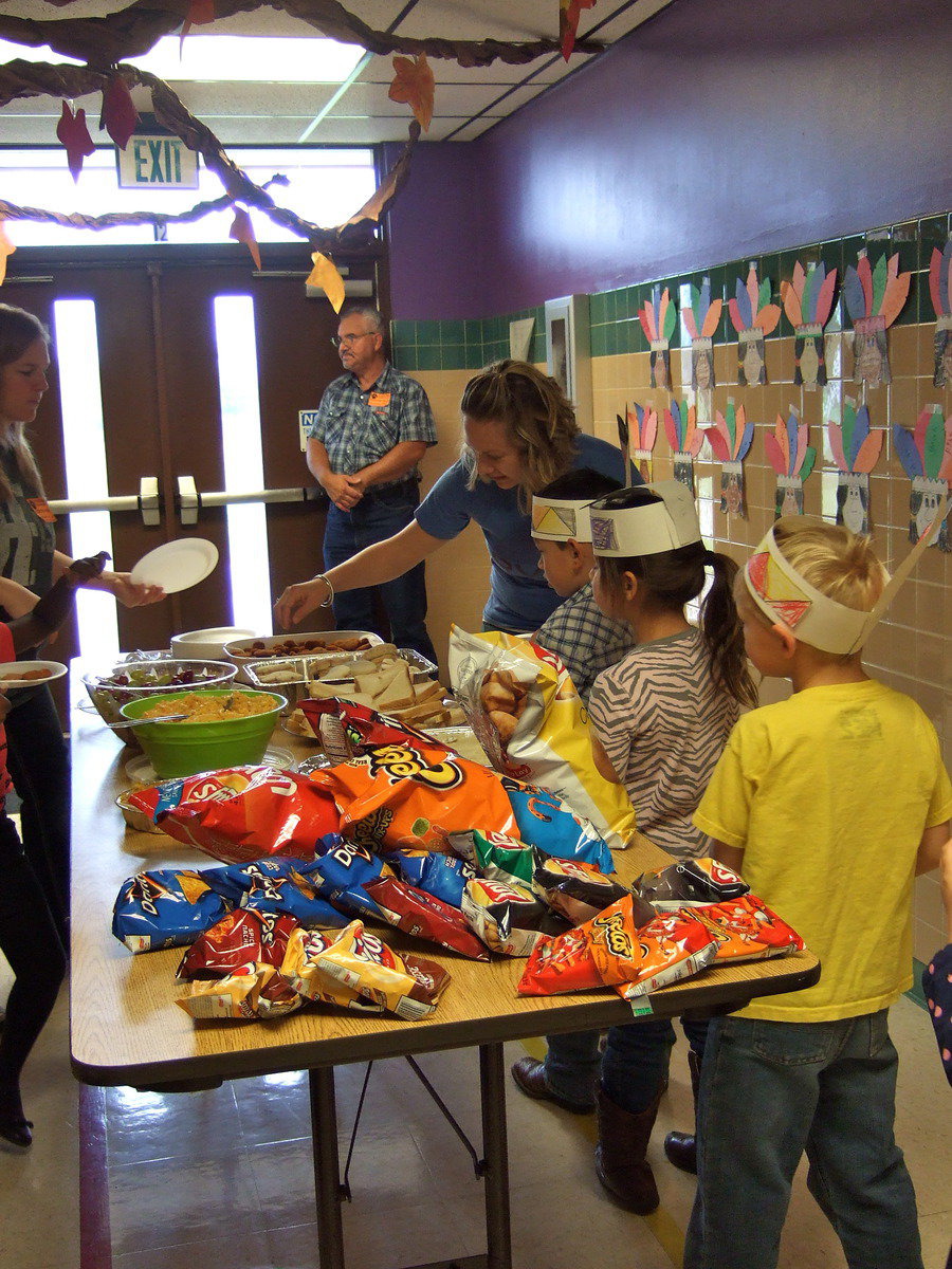 Image: Parents helping serve up the feast.