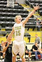 Image: Gladiator junior Cody Boyd(15) defends the basket against Rappaport.