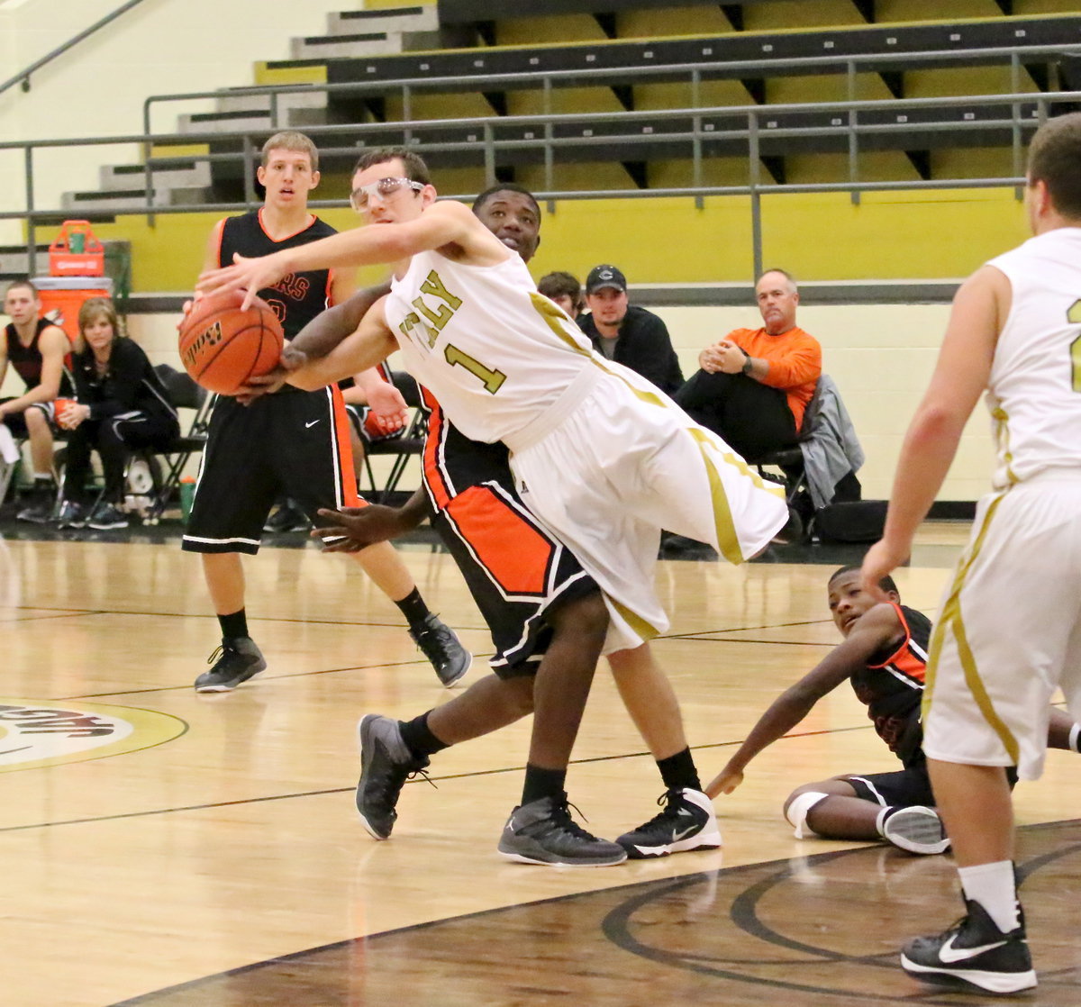 Image: Ryan Connor(1) fights for a loose ball.