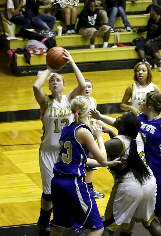 Image: Jaclynn Lewis(13) grabs a rebound and puts it back up for a score.