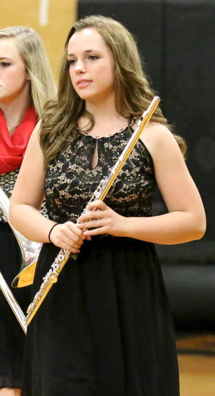 Image: Sarah Levy and her high school band mates take their turn to perform for guests.