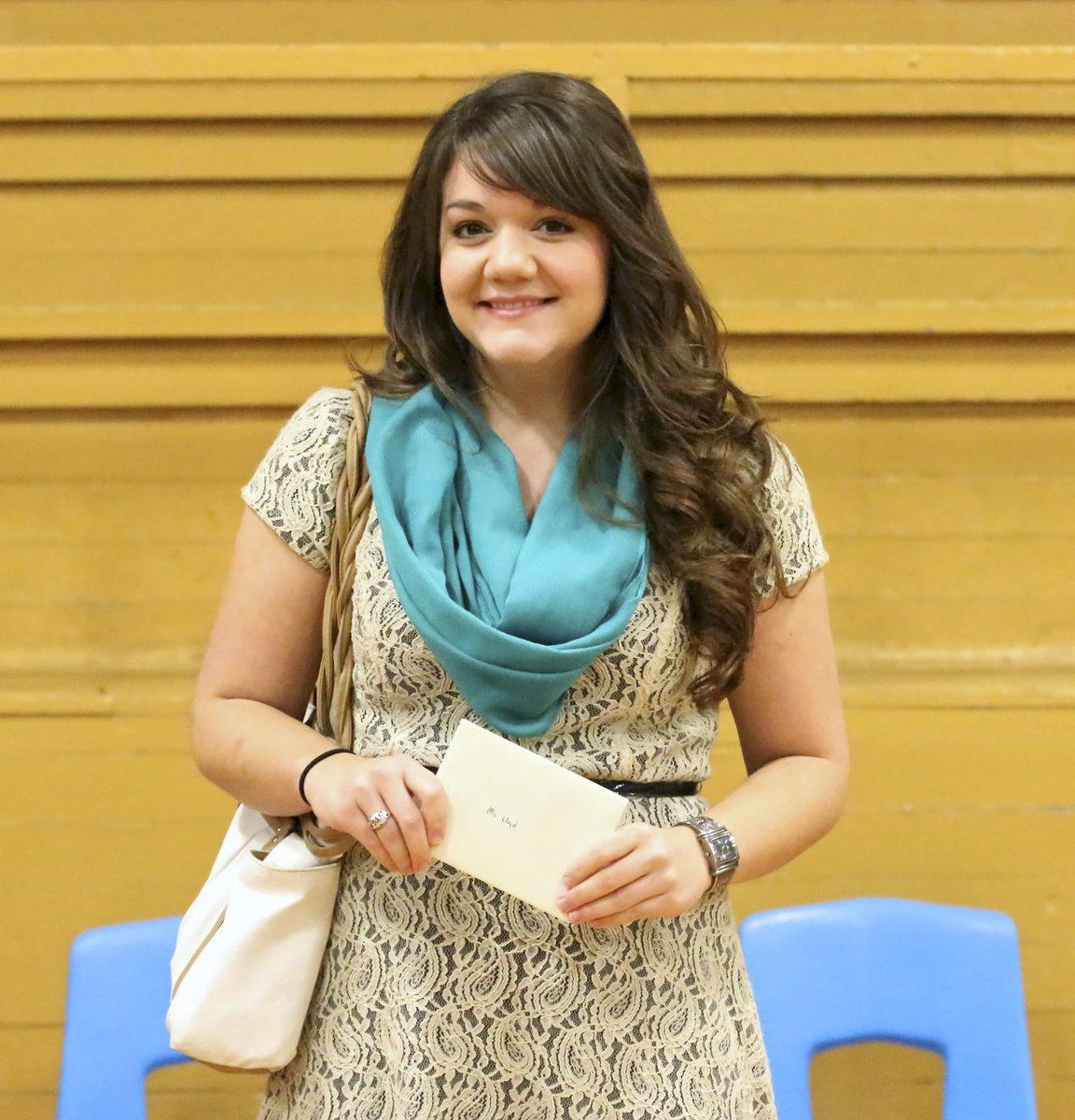 Image: Student band teacher Cherry Lloyd is presented with a gift from Jesus Perez, David Graves and the entire cast of the Gladiator Regiment Band members.