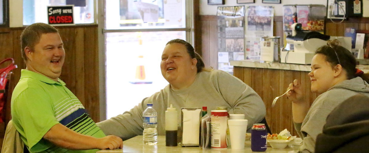 Image: Roy, Michele and Virginia Stephens enjoyed the parade and then their meal inside The Uptown Cafe.