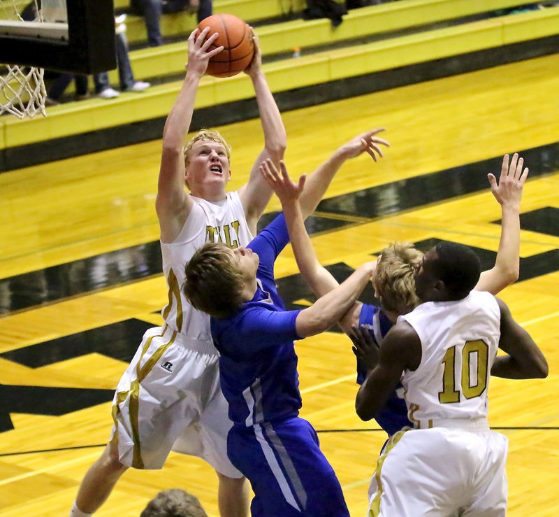 Image: Italy’s Cody Boyd(15) rips down a rebound but its Blooming Grove who scratches out a win against the Gladiators, 64-63.