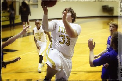Image: Vintage Roldan: Kevin Roldan(33) attacks the basket for the Gladiators.