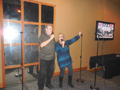 Image: Slay belting a tune his wife, Niesie.