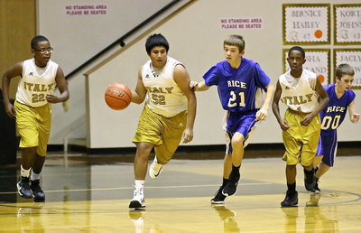 Image: Chris Davila(32) pushes the ball after securing a rebound.