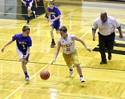 Image: Cason Roberts(21) steals the ball away from Rice.