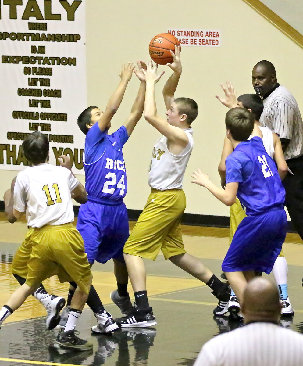 Image: Italy’s, Clay Riddle(30) battles for a rebound.