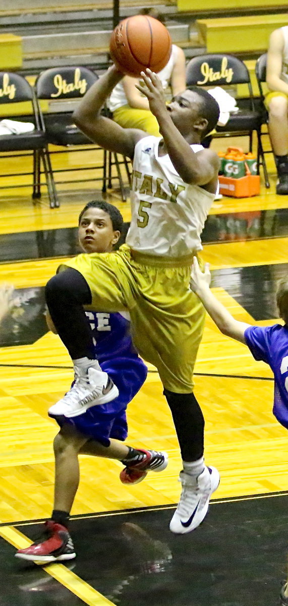 Image: Kendrick Norwood(5) enters the lane and the exits with 2-points.