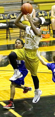 Image: Kendrick Norwood(5) enters the lane and the exits with 2-points.