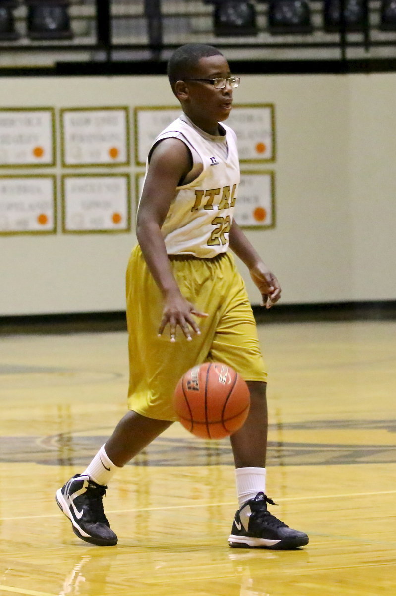 Image: Adam Powell(22) brings the ball across mid-court for Italy’s 7th graders.