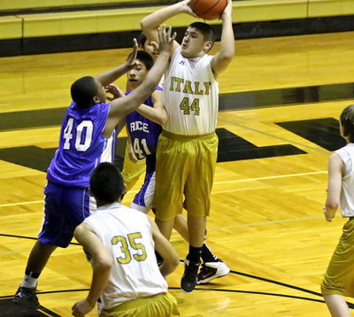 Image: Alex Garcia(44) rises to take the jumper.