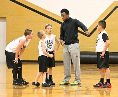 Image: Head coach and one of Italy’s greats, Jasenio Anderson passes on his passion for competition to some future Gladiator greats.