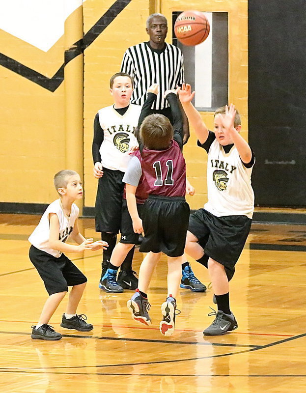 Image: Brodie Hugghins(7), Jayden Saxon(13) and Bryant Haake(3) pressure an Eagle shooter.