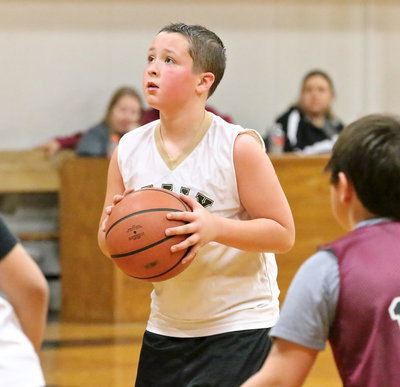 Image: Jayden Saxon(13) shoots a pair of free shots.