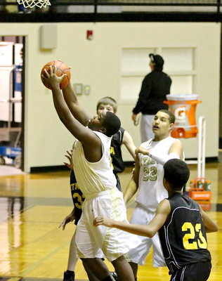 Image: Kenneth Norwood, Jr.(5) secures a rebound for the JV Gladiators.