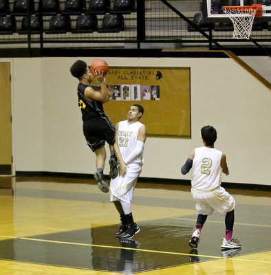 Image: Italy’s Tristan Cotten(33) uses textbook form to draw a charging foul against Itasca.