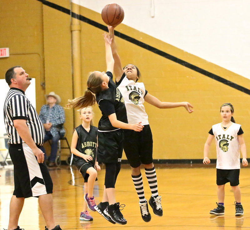 Image: IYAA’s Da’Naisia McCowan(3) wins the tip-off to start the 3rd/4th grade girls matchup between Italy and Abbott.