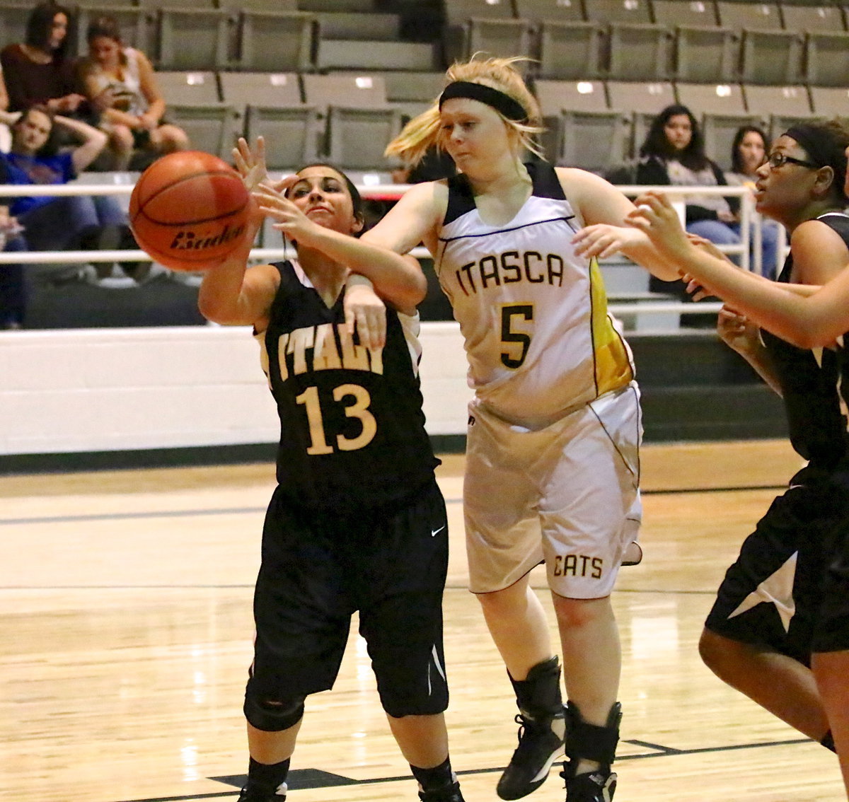 Image: Ashlyn Jacinto(13) absorbs a hard foul from Itasca.