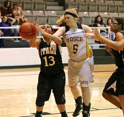 Image: Ashlyn Jacinto(13) absorbs a hard foul from Itasca.