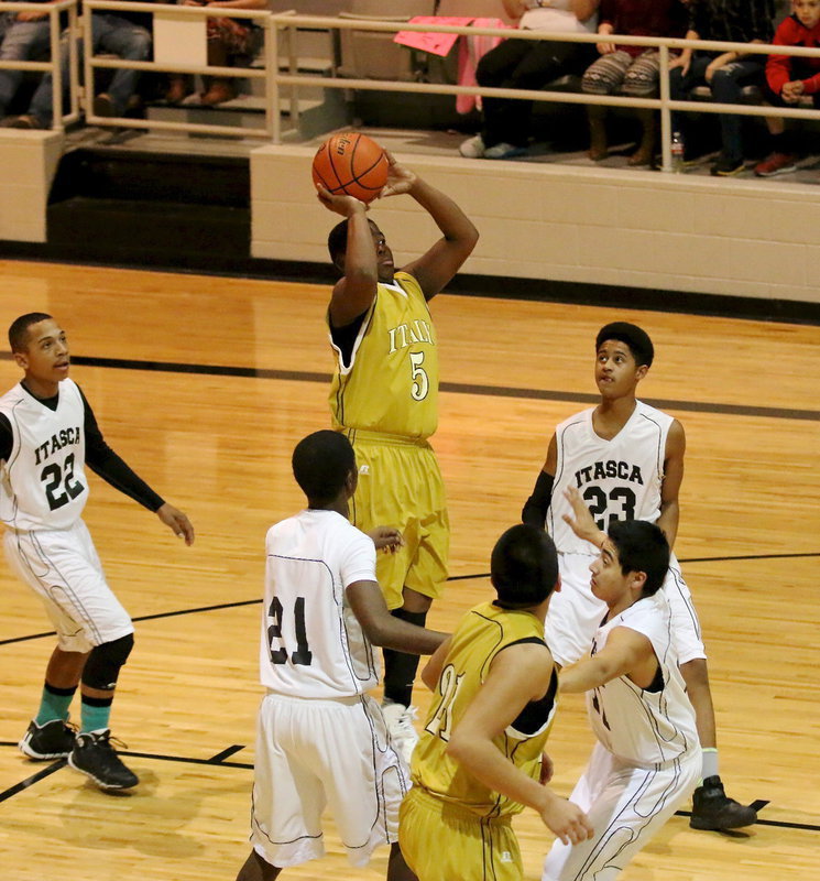 Image: JV Gladiator Kenneth Norwood, Jr. rises above for a lane jumper.