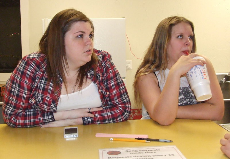 Image: Junior class representatives Taylor Perry and Tia Russell help work the concession stand.