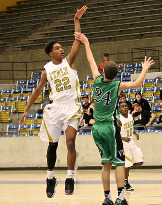 Image: Gladiator Trevon Robertson(22) skies for the jumper over an Eagle defender.
