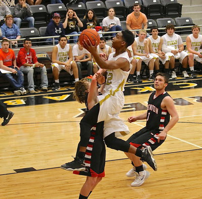 Image: Italy’s Trevon Robertson(22) draws a shooting foul off the fast break.
