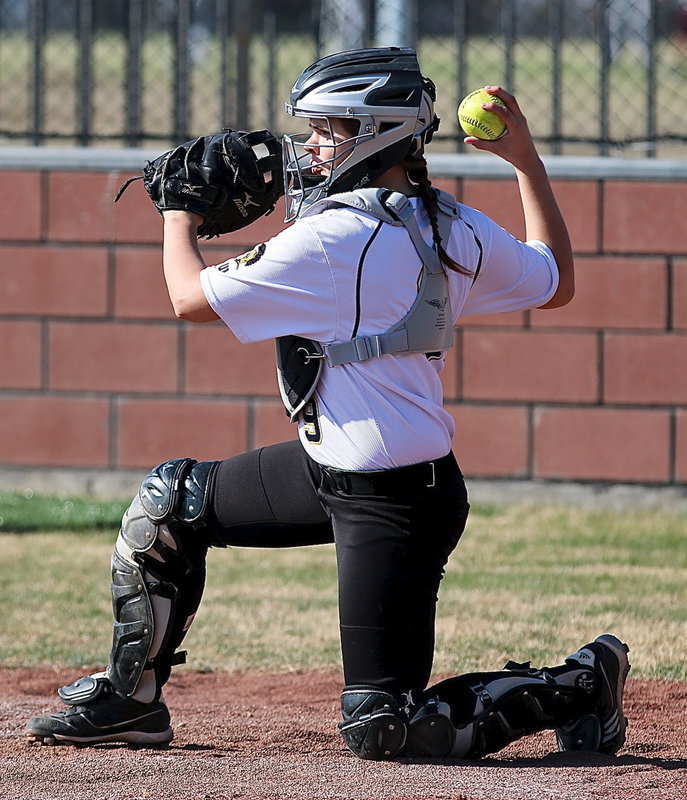 Image: Lady Gladiator catcher Lillie Perry(9) carries her glove like a shield and throws the ball as if she were wielding a sword.
