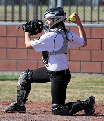 Image: Lady Gladiator catcher Lillie Perry(9) carries her glove like a shield and throws the ball as if she were wielding a sword.