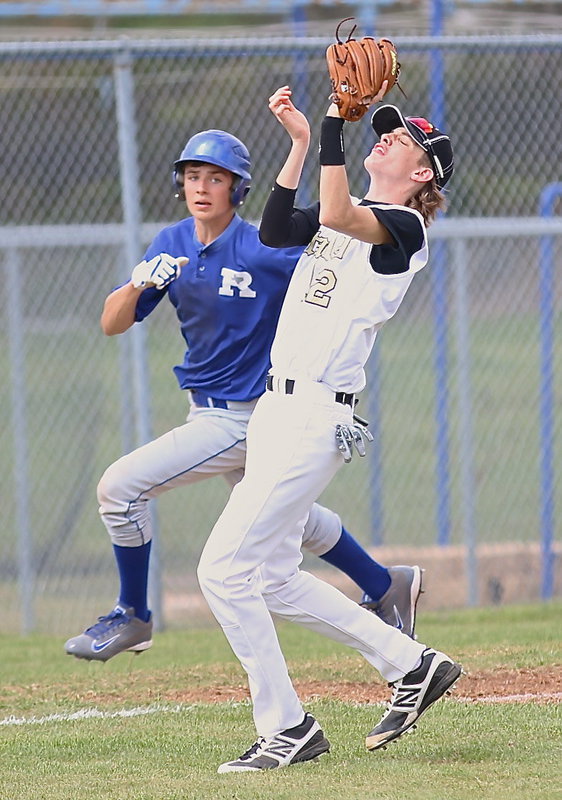 Image: Ty Windham(12) proved he could beat Rice with his eyes closed as he hauls in a fly ball for an out.