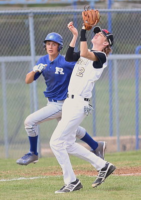 Image: Ty Windham(12) proved he could beat Rice with his eyes closed as he hauls in a fly ball for an out.