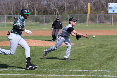Image: Pitcher Ryan Connor(4) fields a grounder and then tosses the ball to first-base for an out against Kerens.