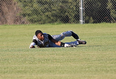 Image: Center fielder Eric Carson(3) makes a dazzling diving catch.