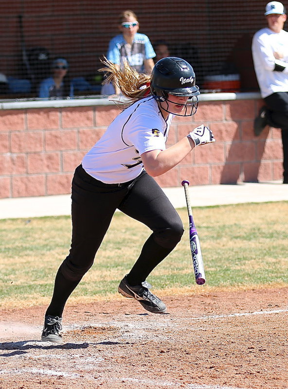 Image: Madison Washington(2) sends a pitch past the Reicher infielders.