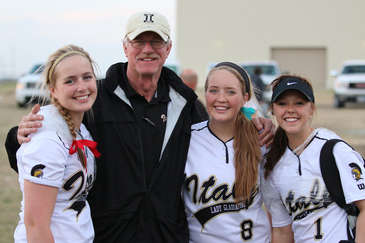 Image: Italy High School athletic director Charles Tindol was a busy coach this weekend, attending track, baseball and softball games as he congratulates Lady Gladiators Madison Washington(2), Hannah Washington(8) and Bailey Eubank(1) on a job well done with Italy’s ladies finishing as the Consolation Winner during the Hillsboro Invitational.