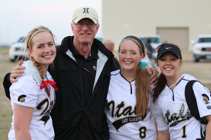 Image: Italy High School athletic director Charles Tindol was a busy coach this weekend, attending track, baseball and softball games as he congratulates Lady Gladiators Madison Washington(2), Hannah Washington(8) and Bailey Eubank(1) on a job well done with Italy’s ladies finishing as the Consolation Winner during the Hillsboro Invitational.