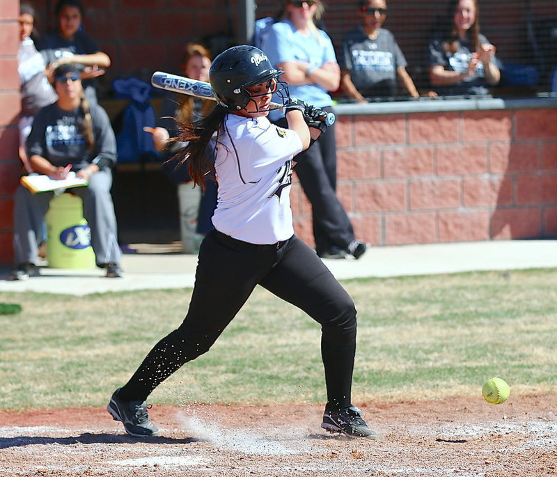 Image: Ashlyn Jacinto(2) hits the ball into play for the Lady Gladiators.